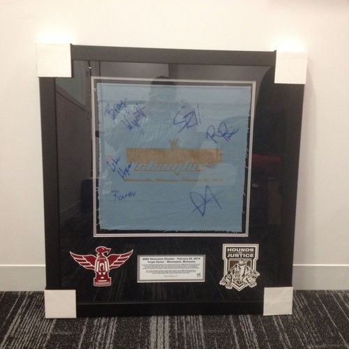 The Shield vs. The Wyatt Family Framed & Signed piece of used ring canvas