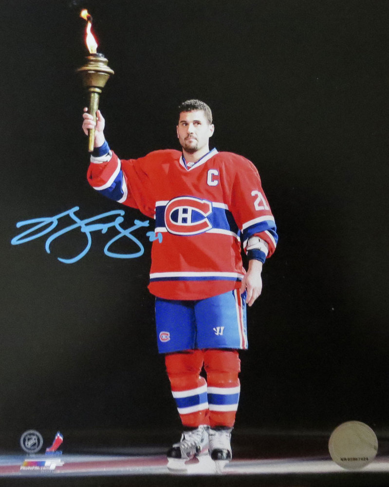 Brian Gionta Autographed 8x10 Photo holding the ceremonial TORCH