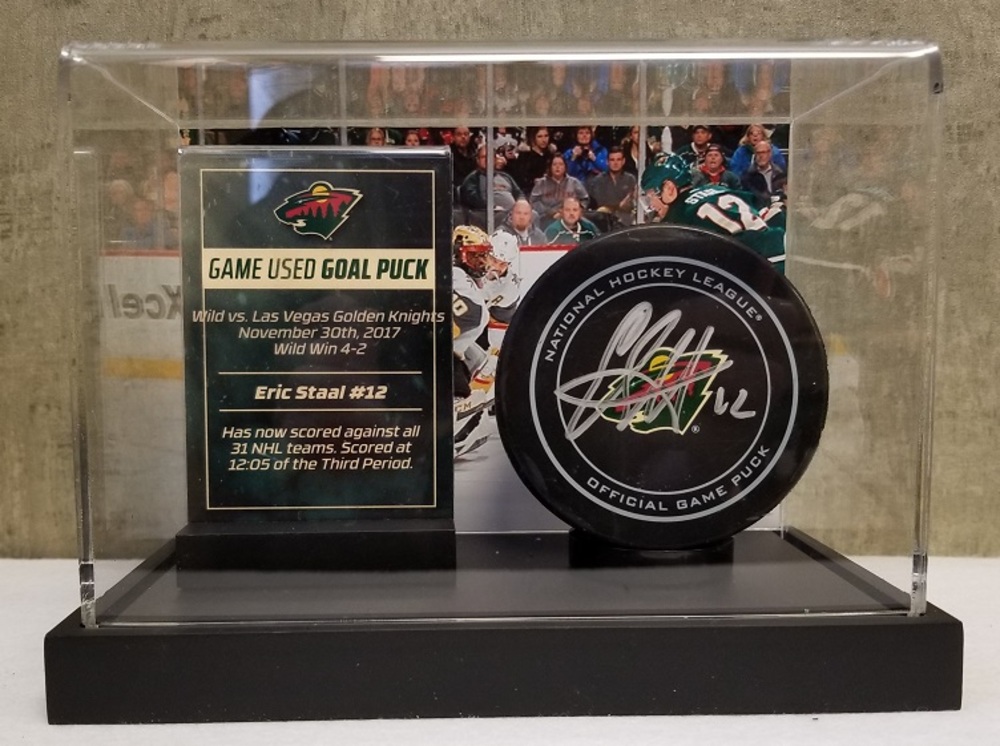 Wild Game Used Goal Puck- Staal, has scored against all 31 NHL teams