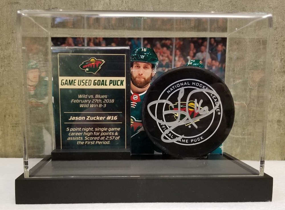 Wild Game Used Goal Puck-Zucker 5 Point Night, career high for points & assists