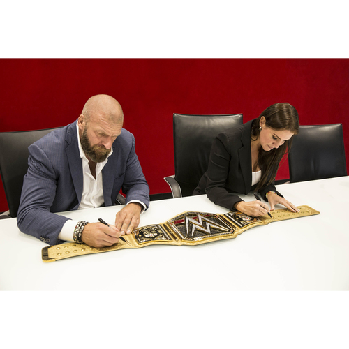 Connor's Cure WWE Championship Replica Title autographed by Stephanie McMahon & Triple H
