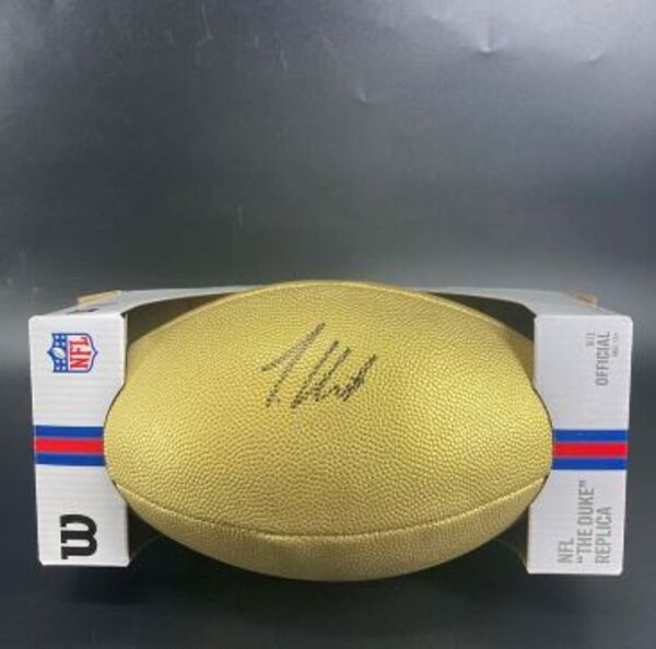 NFL - Jaguars Travis Hunter Signed Gold Composite Football