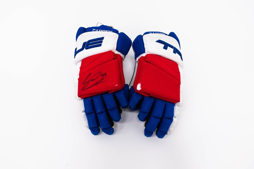 Signed and Game-Used TRUE Gloves by #39 Sam Carrick