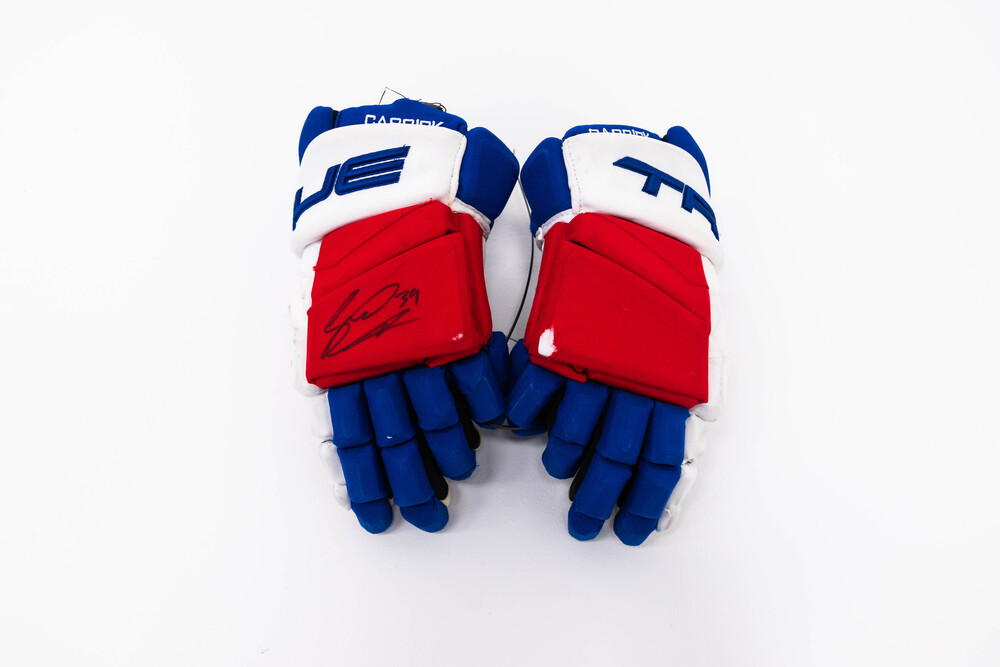 Signed and Game-Used TRUE Gloves by #39 Sam Carrick