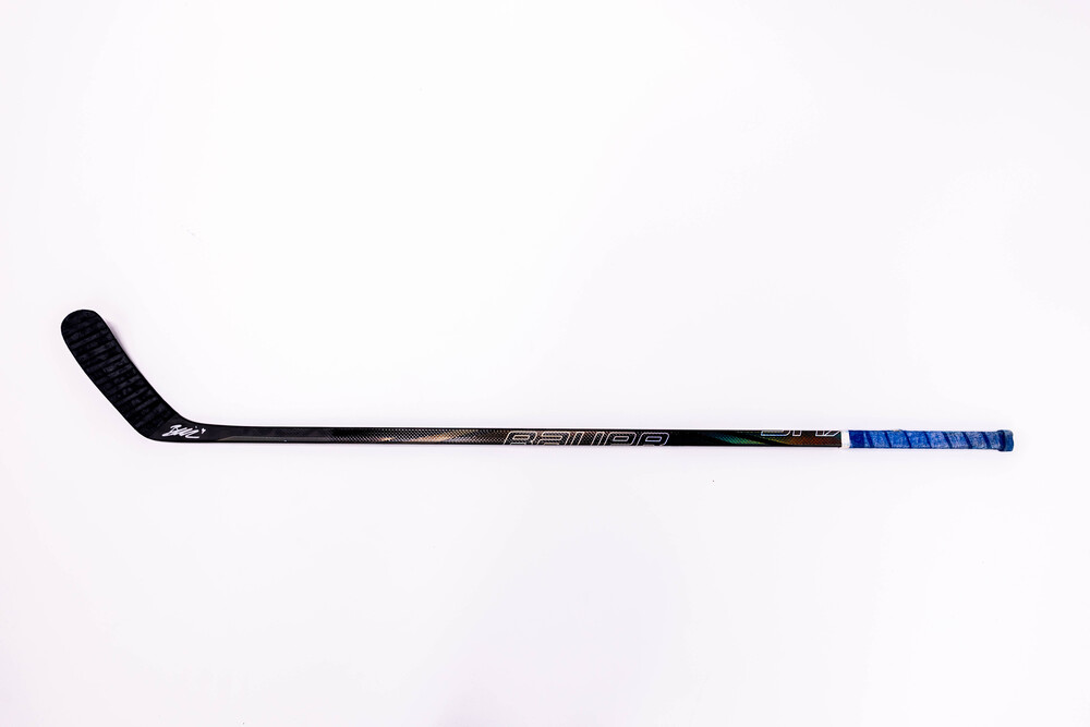 Signed and Game-Used Bauer Stick by #4 Braden Schneider