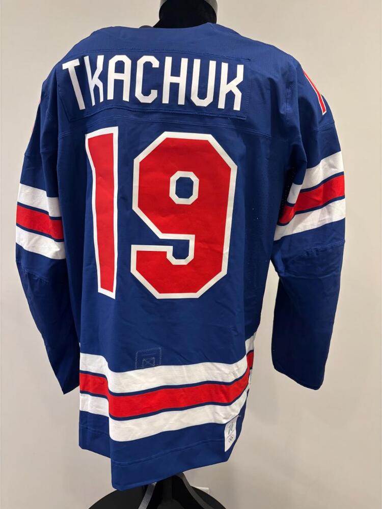 Matthew Tkachuk USA Game-Used Blue Jersey worn v. Denmark on February 14, 2026, as a part of the 2026 Milano Cortina Winter Games.