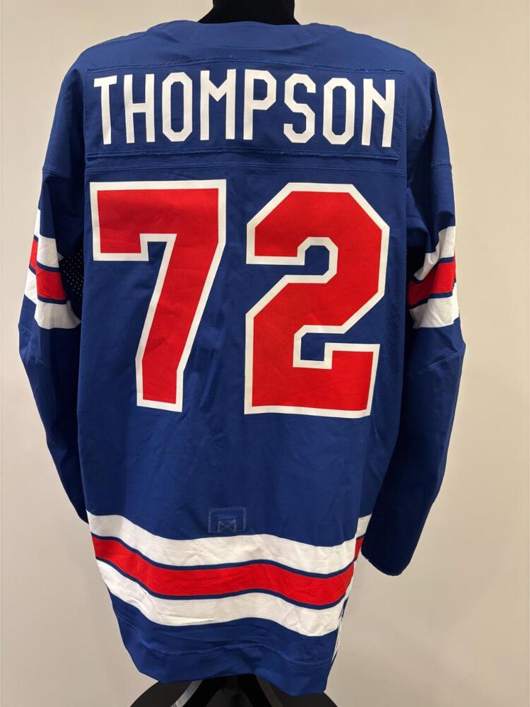 Tage Thompson USA Game-Used Blue Jersey worn v. Denmark on February 14, 2026, as a part of the 2026 Milano Cortina Winter Games.
