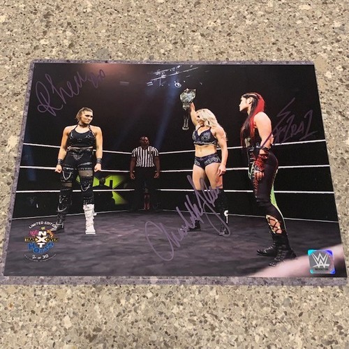 Rhea Ripley, Charlotte Flair, and Io Shirai SIGNED NXT TakeOver In Your House 2020 11x14 Photo (Random Number)