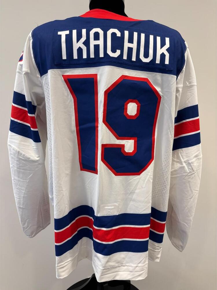 Matthew Tkachuk USA Game-Used White Jersey worn v. Slovakia on February 20, 2026, as a part of the 2026 Milano Cortina Winter Games.