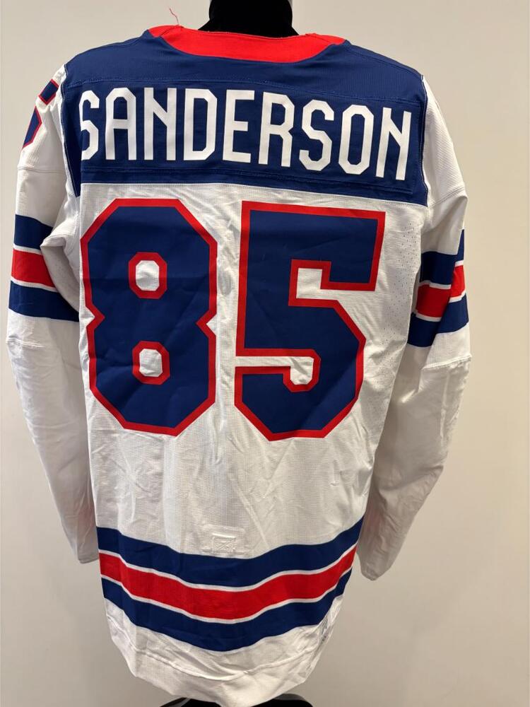 Jake Sanderson USA Game-Used White Jersey worn v. Germany on February 15, 2026, as a part of the 2026 Milano Cortina Winter Games.