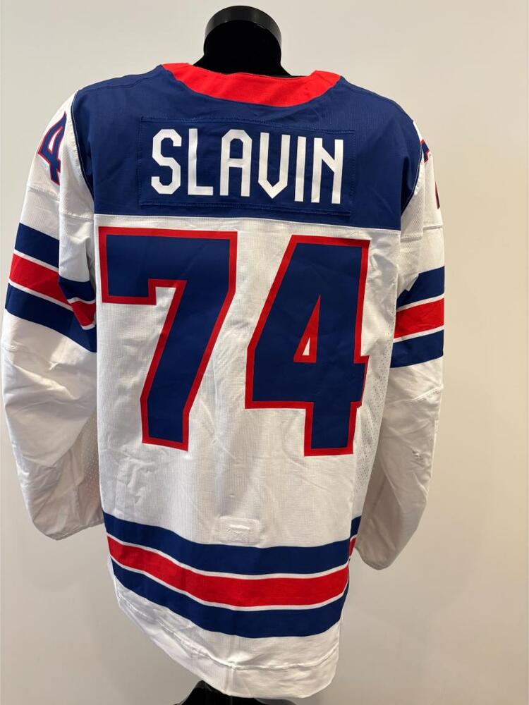 Jaccob Slavin USA Game-Used White Jersey worn v. Germany on February 15, 2026, as a part of the 2026 Milano Cortina Winter Games.