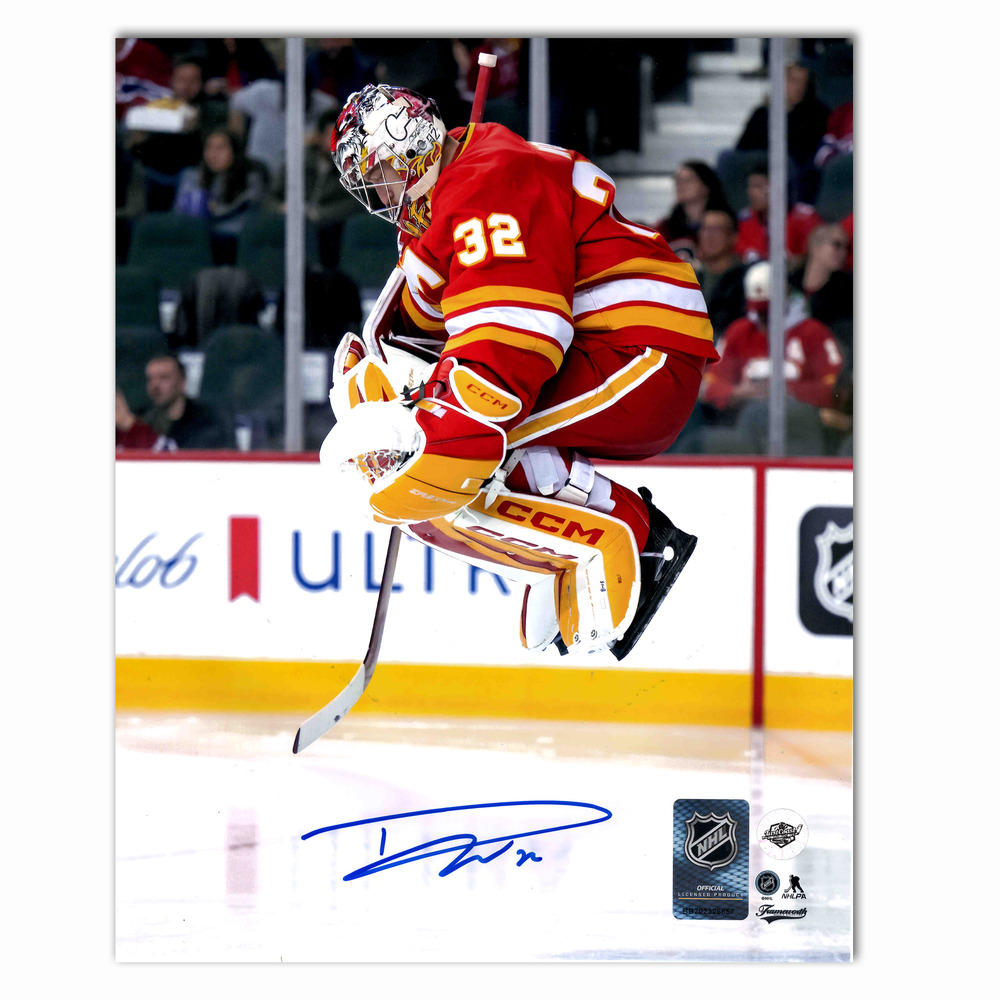 Dustin Wolf Autographed Calgary Flames Home Jumping 8x10 Photo