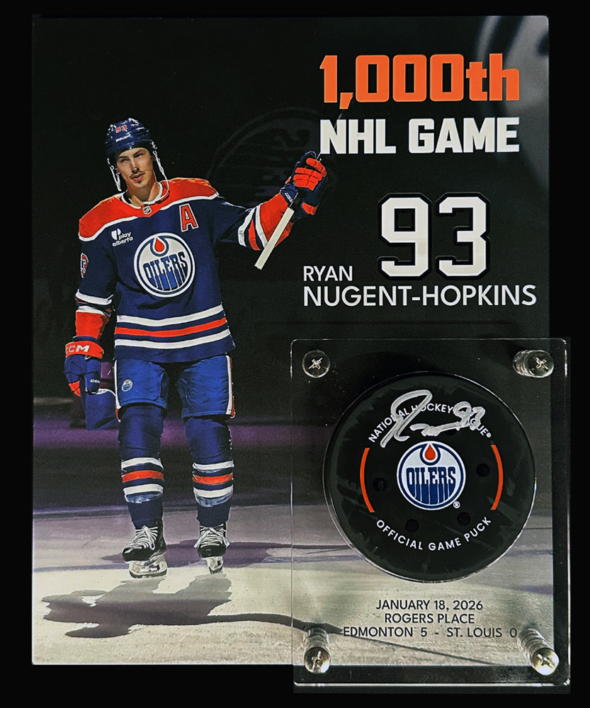 Ryan Nugent-Hopkins #93 - Autographed Game Used Puck From His 1000th NHL Game On January 18, 2026 vs The St. Louis Blues - Includes Custom Display Holder