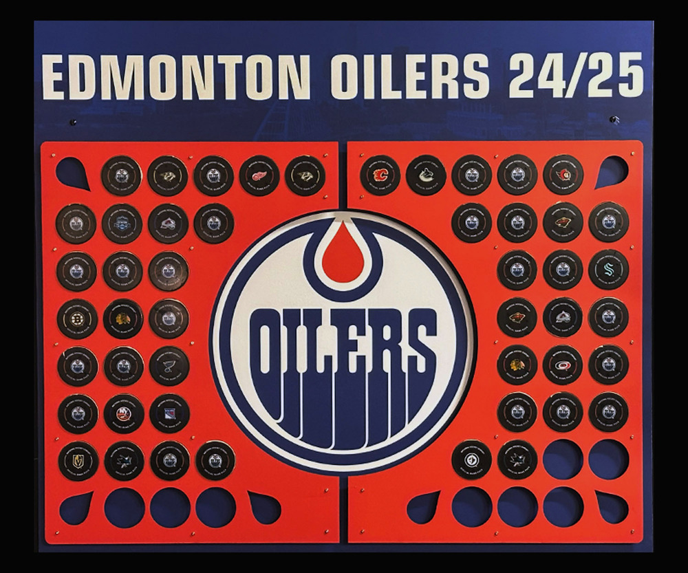 2024-25 Edmonton Oilers Locker Room Custom Puck Display With Game Pucks Representing All 48 Oilers Regular Season Home And Road Game Wins