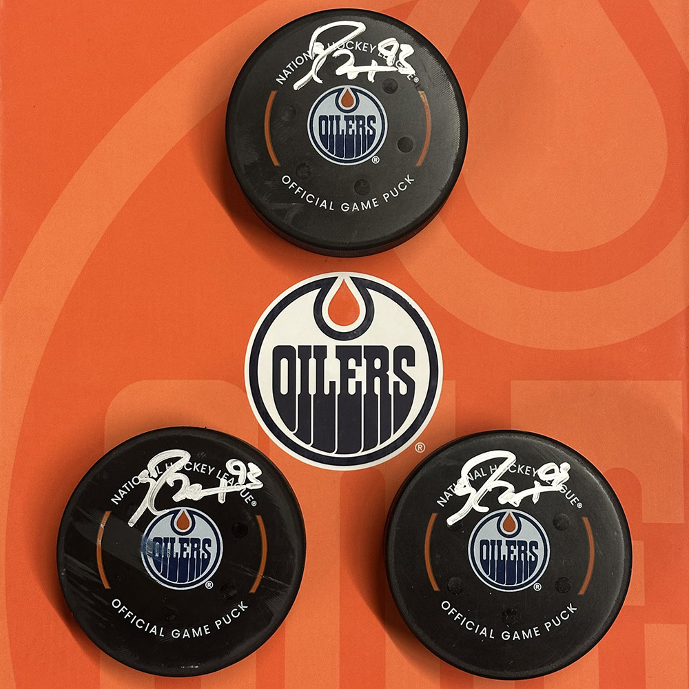 Ryan Nugent-Hopkins #93 - Autographed Edmonton Oilers Hat Trick Goal Puck Set Scored On March 22, 2025 vs. Seattle Kraken - 4th NHL Hat Trick Of His Career!