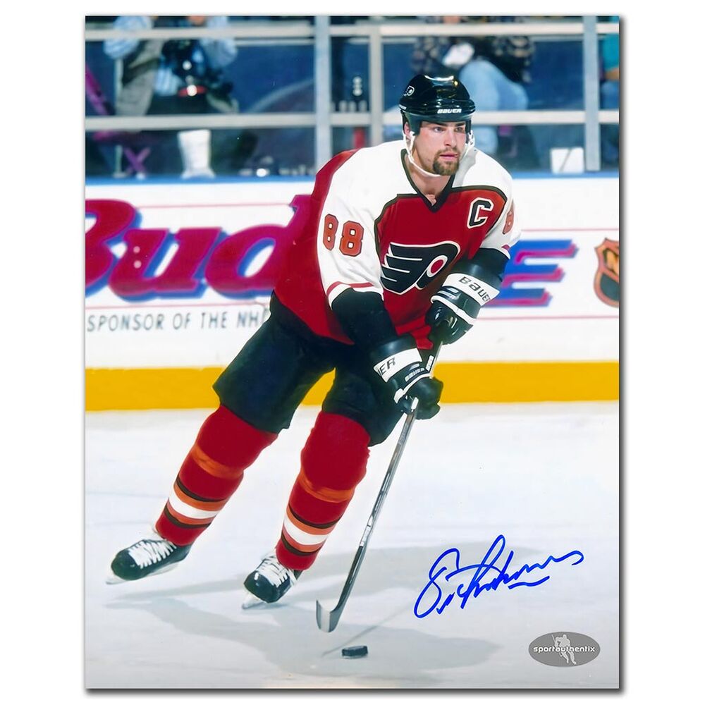 Eric Lindros Autographed Philadelphia Flyers 8x10 Photo - Skating with Puck