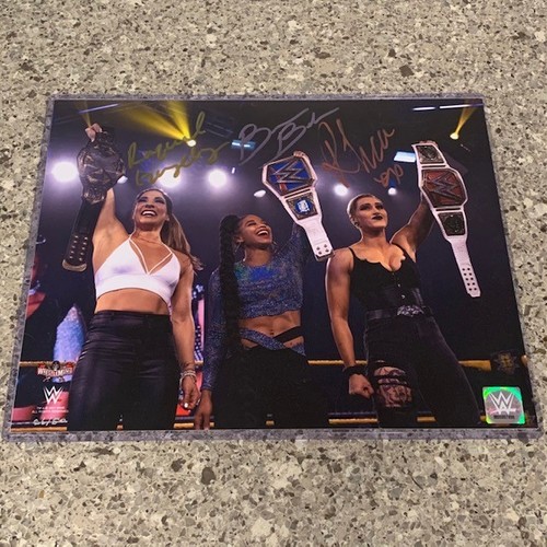 Raquel Gonzalez, Bianca Belair, and Rhea Ripley SIGNED 11x14 Photo (Random Number)
