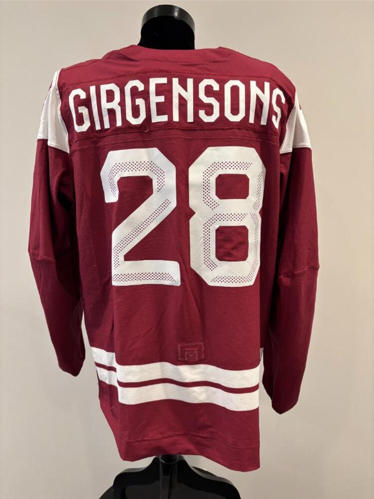 Zemgus Girgensons Latvia Game-Used Red Jersey worn v. USA on February 12, 2026, as a part of the 2026 Milano Cortina Winter Games.