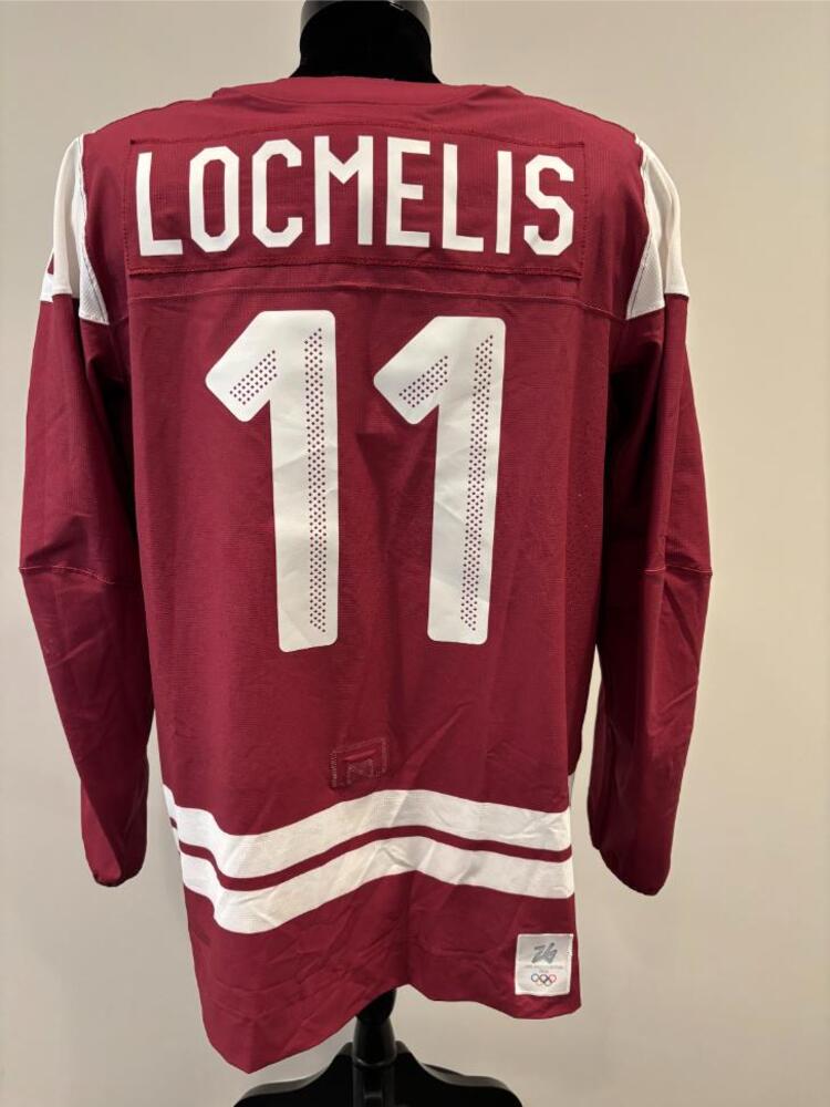 Dans Locmelis Latvia Game-Used Red Jersey worn v. USA on February 12, 2026, as a part of the 2026 Milano Cortina Winter Games.