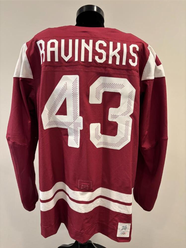 Anri Ravinskis Latvia Game-Used Red Jersey worn v. USA on February 12, 2026, as a part of the 2026 Milano Cortina Winter Games.