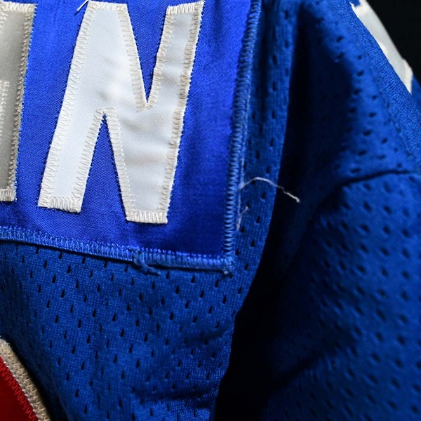Close-Up of loose thread on Nameplate of Dave Christian Blue Team USA Gold Medal Game-Worn Photo-Matched Jersey.