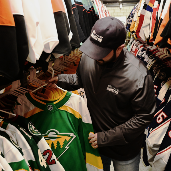 Photo of MeiGray Sales Associate pulling an order off our item racks.