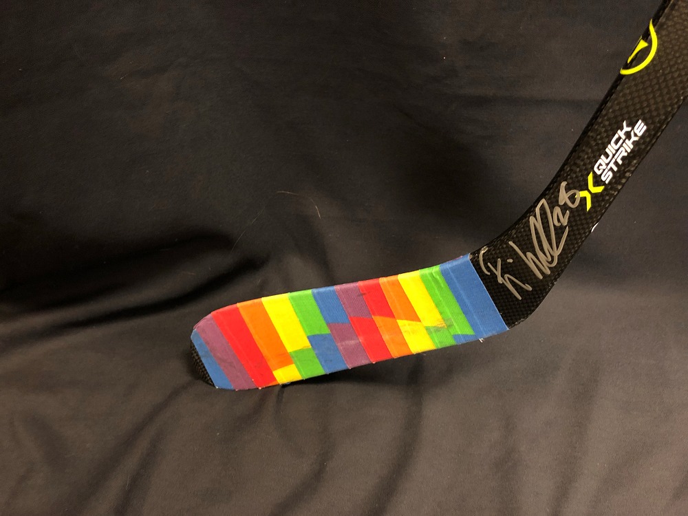 Elias Lindholm #28 Autographed Pride Tape Stick