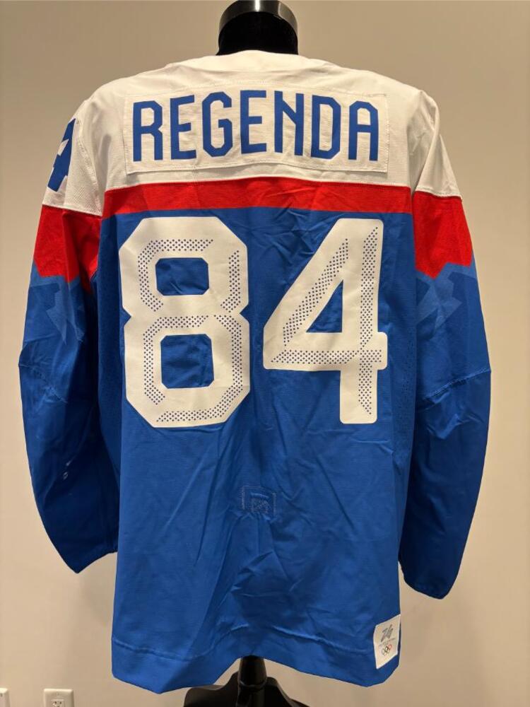 Pavol Regenda Slovakia Game-Used Blue Jersey worn v. Germany on February 18, 2026, as a part of the 2026 Milano Cortina Winter Games.