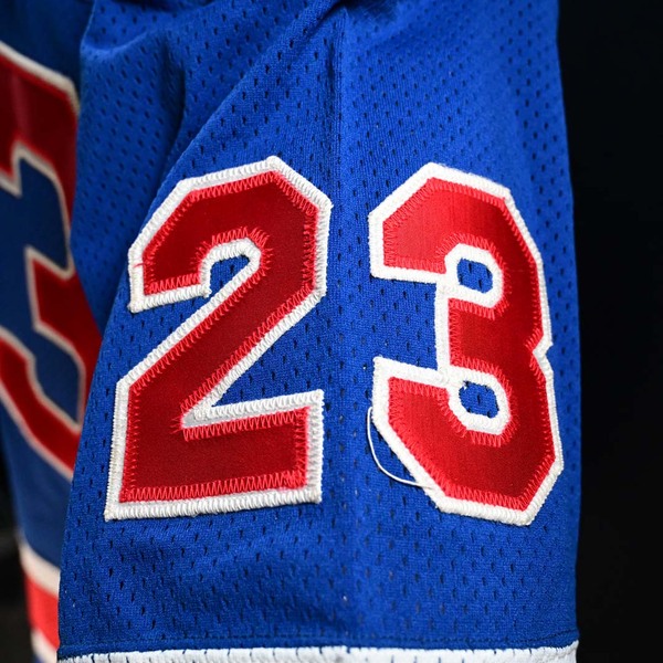 Close-Up of number 23 with loose thread on Sleeve of Dave Christian Blue Team USA Gold Medal Game-Worn Photo-Matched Jersey.