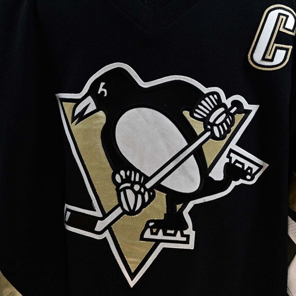 Close-Up of Penguins logo on Front of Mario Lemieux Black Set 1 Pittsburgh Penguins Game-Worn Photo-Matched Jersey.