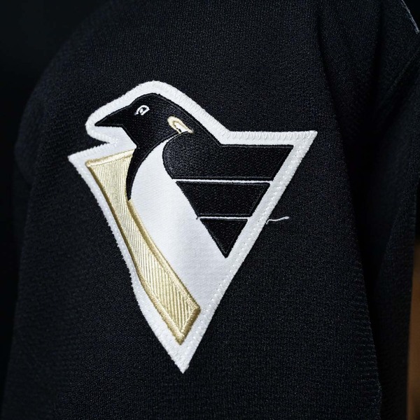 Close-Up of Secondary logo on Sleeve of Mario Lemieux Black Set 1 Pittsburgh Penguins Game-Worn Photo-Matched Jersey.