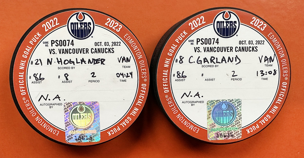 nils-hoglander-21-conor-garland-8-vancouver-canucks-goal-pucks