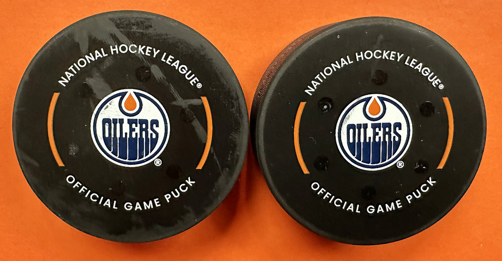 nils-hoglander-21-conor-garland-8-vancouver-canucks-goal-pucks